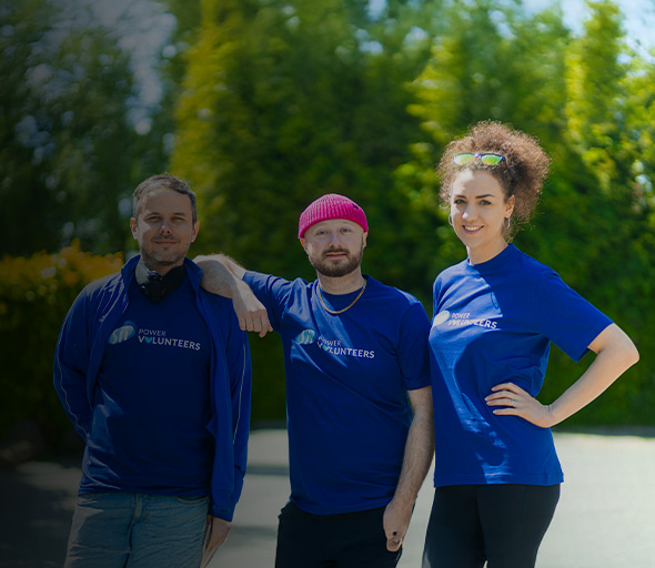 Three people in Sii Power Volunteers t-shirts